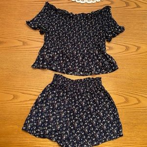 Navy short set with floral pattern.